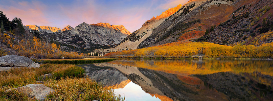 A beautiful autumn view with rocky mountains and lake