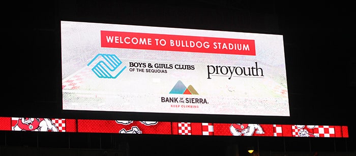 Bulldog Stadium billboard with Bank of the Sierra, ProYouth, Boys & Girls club logos